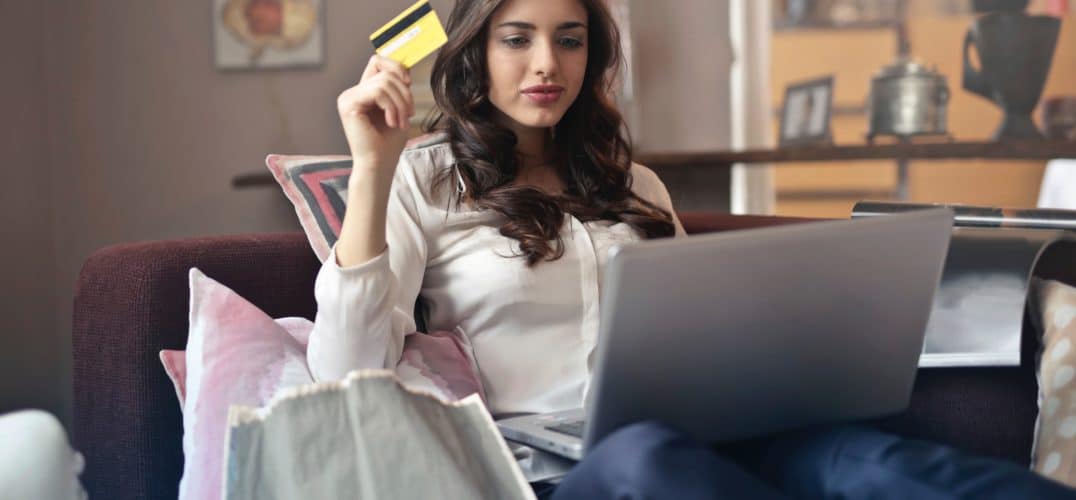 Woman with credit card and computer