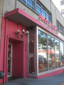 Pink door and store front of Miss Pixie's