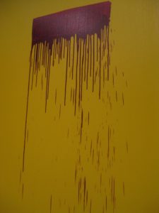 Painting with a yellow background and a purple stripe