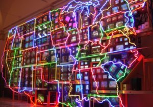 The United States is lit up in neon colors on an electric superhighway