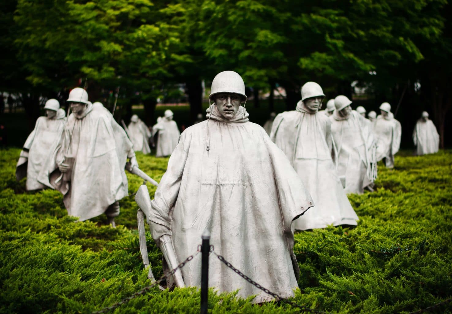 soldier statues wearing all natural cement color rain gear